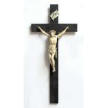 IVORY CRUCIFIX, 17th century style but probably 19th century Dieppe, on an ebony cross, height of