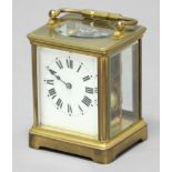 BRASS FOUR PANE CARRIAGE CLOCK, with an enamelled dial on an eight day movement half hourly striking