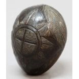 CARVED COCONUT, probably 18th century, carved with a heart, crosses and a garter type star, length