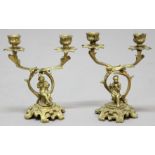 PAIR OF GILT METAL FIGURAL CANDELABRA, modelled as a pair of musicians beneath foliate, scrolling