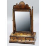 EARLY 18TH CENTURY WALNUT TOILET MIRROR, perhaps Queen Anne, the bevelled plate in a moulded frame