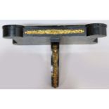 EBONISED AND GILT METAL MOUNTED CLOCK BRACKET, 19th century, of shaped rectangular form with