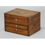 MAHOGANY AND BRASS MOUNTED DRESSING CHEST, mid 19th century, the hinged cover enclosing a fitted