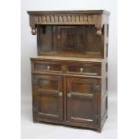 OAK COURT CUPBOARD, 18th century and later, a central panelled door above a pair of drawers and a