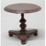 MAHOGANY MINIATURE TILT TOP TABLE, 19th century, with turned column and triangular platform base,