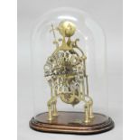 BRASS SKELETON CLOCK, the 5 1/2" silvered chapter ring on a brass, single fusee, eight day