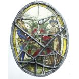 OVAL STAINED GLASS PANEL, depicting a medieval couple either side of a coat of arms, 24cm x 18cm