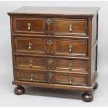 OAK CHEST OF DRAWERS, probably late 17th century and later, the four graduated long drawers with