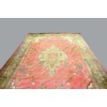 BORLU CARPET, the pale candy pink field sparsely decorated with angular vines around a medallion,