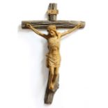 RENAISSANCE STYLE CARVED WOOD CRUCIFIX, probably 19th century, mounted on a rustic cross, height