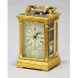 GILT BRASS FOUR PANE CARRIAGE CLOCK, the silvered dial inscibed Chas. Frodsham beneath roman