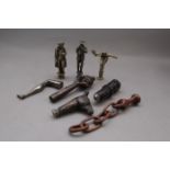 Four Treen Pipe Stoppers and four Brass including Napoleon and a Hand Holding a Pipe (8)