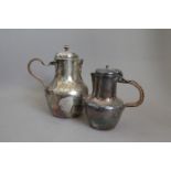 Two Silver Coloured Metal Jugs