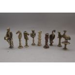 Eight Brass Stoppers including two Jockeys, Two Horses's Heads and Four Birds and Bone Examples (9)