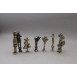 Eight Brass Stoppers Including Britannia, Thistles, Two Hands etc