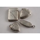 A VICTORIAN SILVER OVAL VESTA CASE with diagonal fluting, by S. Mordan & Co., London 1890, another