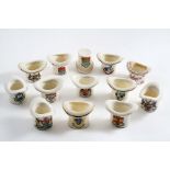 THIRTEEN 20TH CENTURY "CRESTED" PORCELAIN TOP HAT VESTA HOLDERS/STRIKERS (Ryde, Rochester, Bridgend,