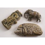 A LATE 19TH CENTURY PLATE BRASS ELEPHANT VESTA CASE and two other plated brass vestas; the left