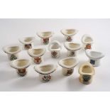 THIRTEEN 20TH CENTURY "CRESTED" PORCELAIN TOP HAT VESTA HOLDERS/STRIKERS (Winchester, Southampton,