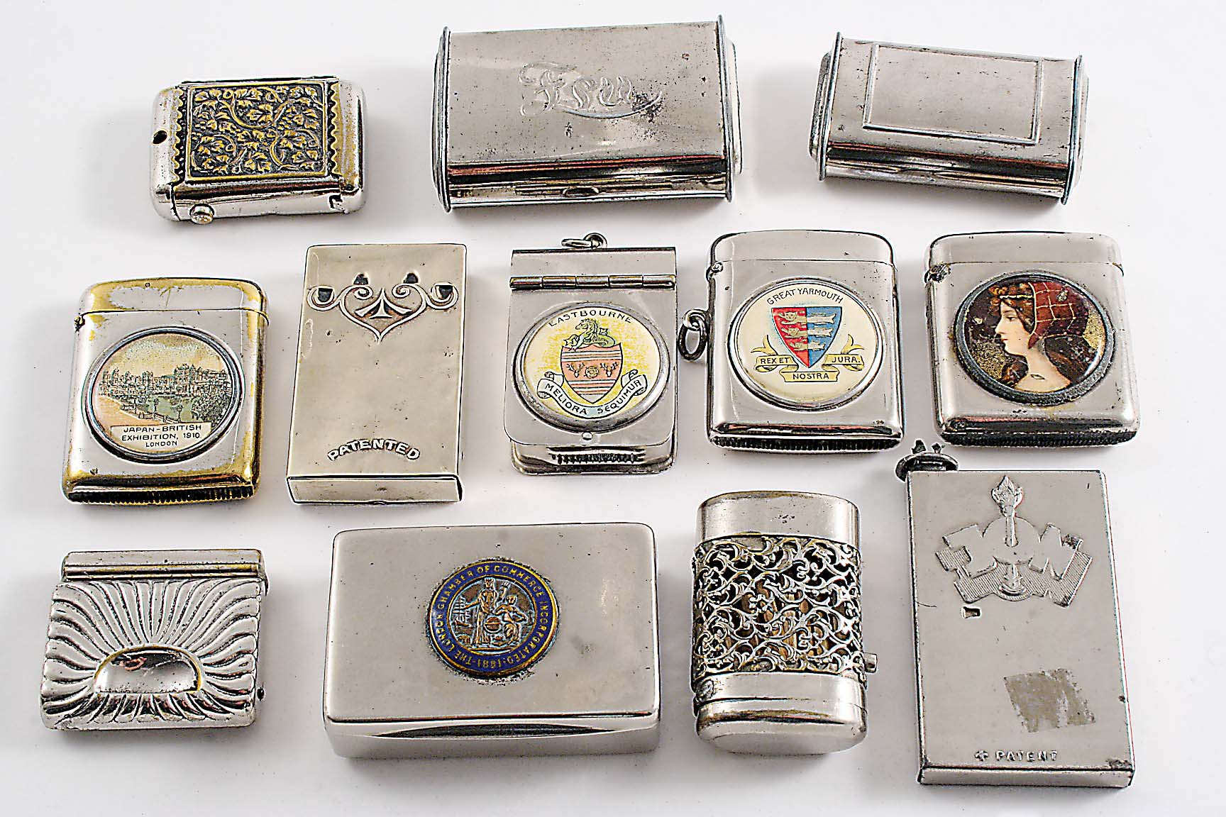 TWELVE VARIOUS LATE 19TH / EARLY 20TH CENTURY NICKEL-PLATED VESTA CASES (including one inset with