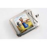 A LATE VICTORIAN SILVER VESTA CASE enamelled on the front with a lady golfer, her caddy and