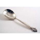 AN EARLY 20TH CENTURY DANISH ACANTHUS PATTERN SERVING SPOON by Georg Jensen with English import