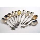 A SET OF SIX AND FIVE OTHER VARIOUS SINGLE DUTCH SPOONS with decorative stems and cast terminals,