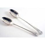 A GRADUATED PAIR OF GEORGE III OLD ENGLISH PATTERN BASTING SPOONS crested, by Stephen Adams,