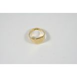AN 18CT. GOLD SIGNET RING engraved with initials, 10.5 grams. Size R 1/2.