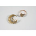 A VICTORIAN GOLD AND PEARL SET CRESCENT AND STAR BROOCH the star set with a small diamond and