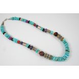 A TURQUOISE AND GEM SET NECKLACE 52cm. long.