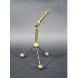 ARTS & CRAFTS BRASS TABLE LAMP in the manner of W.A.S Benson, with an adjustable top section and
