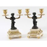 PAIR REGENCY BRONZE AND ORMOLU CANDELABRA the bronze fawns on outswept marble bases, height 24cm (