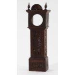 CHIP CARVED OAK POCKET WATCH CASE in the form of a miniature longcase, carved with flowers and