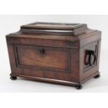 REGENCY MAHOGANY AND ROSEWOOD TEA CADDY of sarcophagus form with flattened top, height 18cm, width