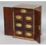 ROSEWOOD AND BRASS BOUND TABLE CABINET 19th century, the interior with one long and six short