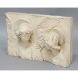 TERRACOTTA BAS-RELIEF, in the manner of Della Robbia, cast as the heads of an angel and a saint,
