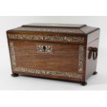 REGENCY ROSEWOOD TEA CADDY of sarcophagus form with scrolling ivory inlay and fitted interior,