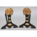PAIR OF ARTS AND CRAFTS IRON AND COPPER FIRE DOGS, with stylised flowerhead finial, height 30.5cm,