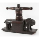 18TH CENTURY WOODEN CHEESE PRESS with pegged T-shape pummel, block base and carved pig either