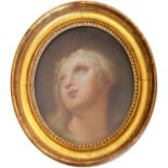 MANNER OF GUIDO RENI (1575-1642) HEAD STUDY OF A WOMAN, FACE UPTURNED Pastels, oval 37 x 30cm. ++