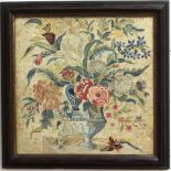 GEORGE III EMBROIDERED PICTURE, worked in gross and petite pointe, with a vase of flowers on a