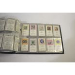 A LARGE QTY OF CIGARETTE CARD ALBUMS a large qty cigarette and tea cards in albums, including
