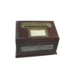 MAHOGANY LETTER BOX a mahogany letter box with brass slot, with a label giving postage times and