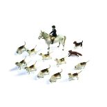 BESWICK HUNTING SET including a Huntswoman on a Grey Horse, Model No 1730 and issued from 1960-1995.
