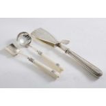 AN EDWARDIAN SUGAR SIFTER SPOON & MATCHING SUGAR SPOON with ivory cannon handles, initialled,