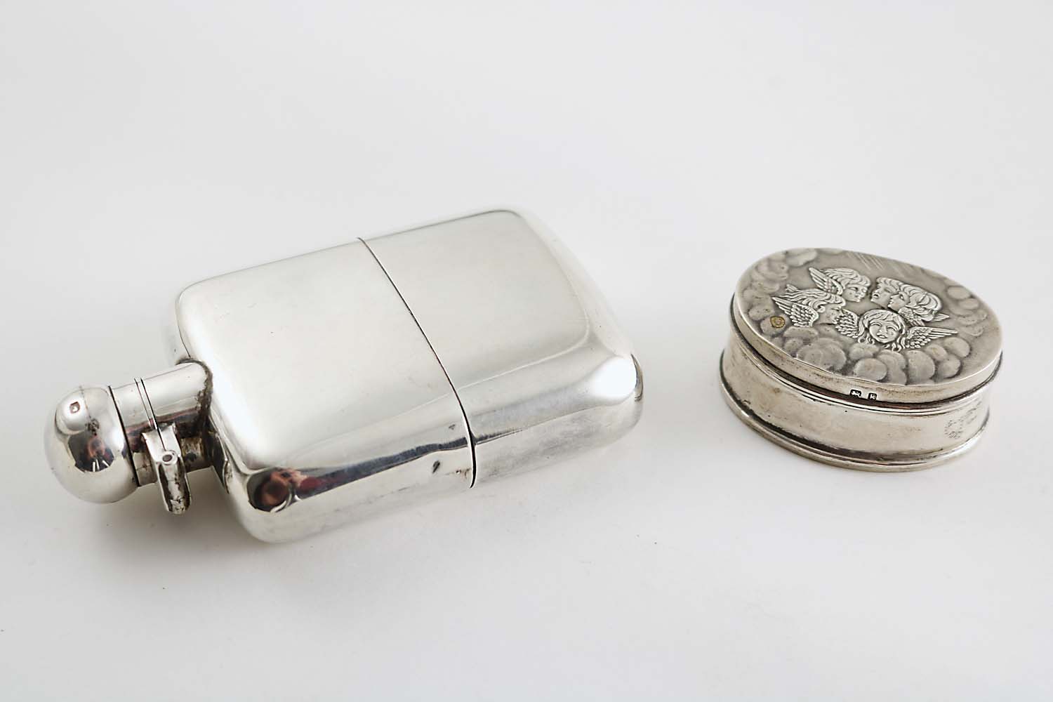 AN EARLY 20TH CENTURY SPIRIT FLASK of rectangular form with rounded corners & a pull-off base by