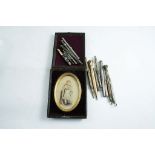 A GROUP OF GILT METAL AND SILVERED PENCILS and one enamelled and a photo portrait in folding case