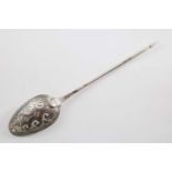 A GEORGE II MOTE SPOON with a diamond point finial, the bowl pierced with scrolls & drilled holes,