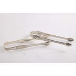 A PAIR OF GEORGE III ENGRAVED SUGAR TONGS by N. Smith & Co., Sheffield 1796 and an engraved
